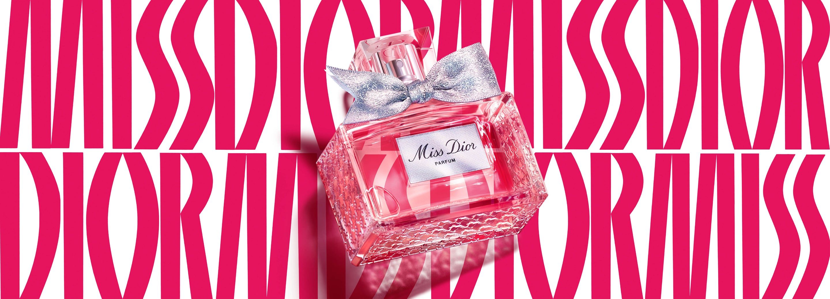 於Miss Dior標誌性背景下的Miss Dior香精照片 